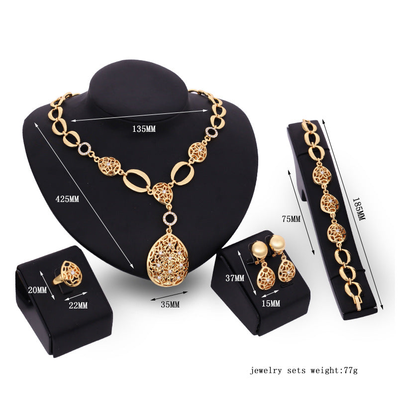 Conjunto de joyería de cuatro piezas: collar, pendientes, pulsera, anillo