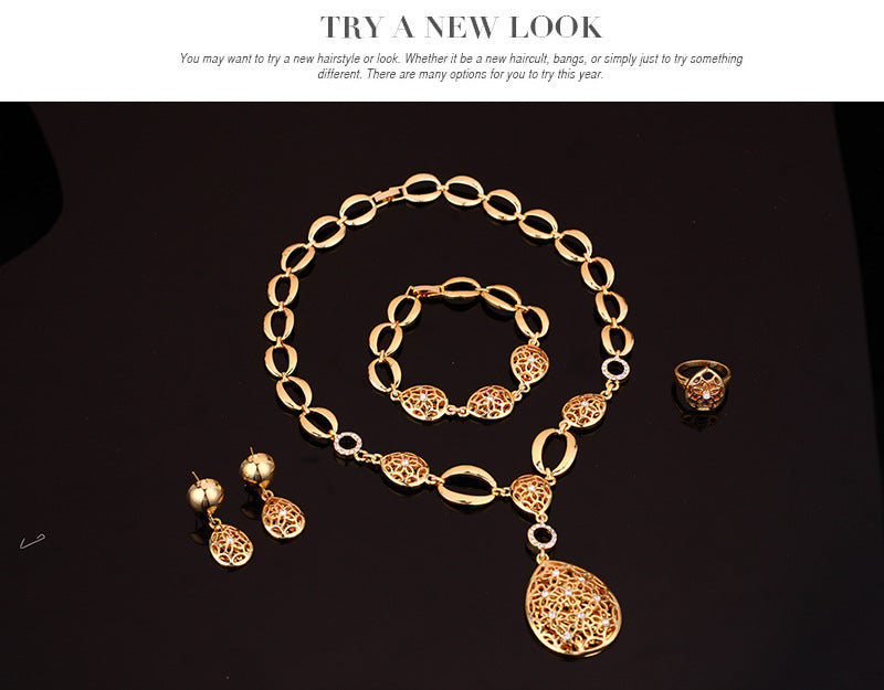 Conjunto de joyería de cuatro piezas: collar, pendientes, pulsera, anillo